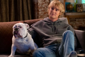 (from left) Charlie Gilbert’s dog Tank (Romeo) and Charlie Gilbert (Owen Wilson) in Marry Me, directed by Kat Coiro.