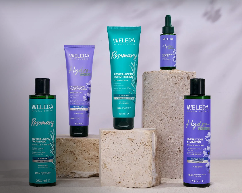 produits weleda bleu sur roches carrée avec fond blanc